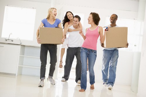 Local home move planning in Neasden with packed boxes and moving van