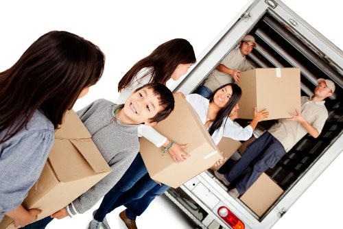 Man and van removals service working in Neasden with a moving van and boxes
