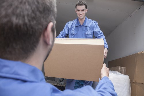 Removal van and moving boxes in a Neasden residential street