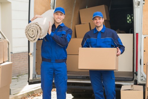Moving team preparing items safely for a man with van service