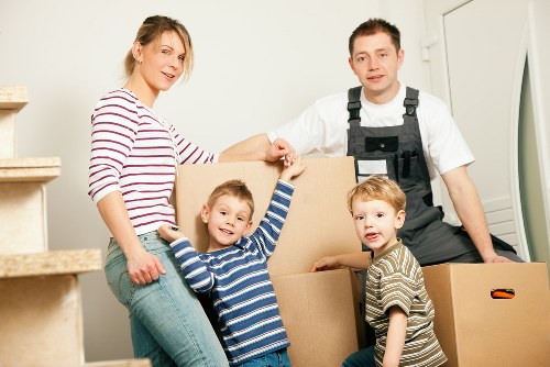Professional movers handling furniture during a Neasden house move