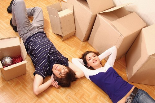 Packed moving boxes and furniture prepared for transport in Neasden