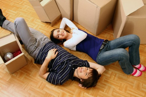 Packed moving boxes and furniture ready for house removals in Neasden