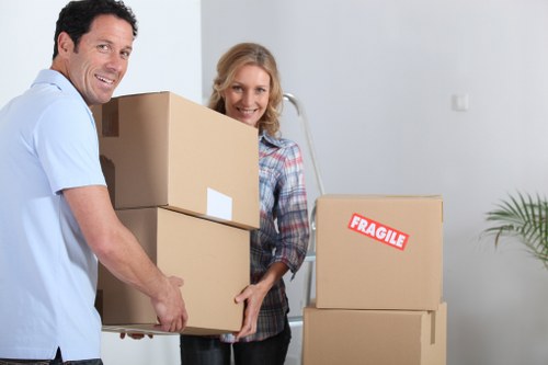 Loading furniture into a van for a Neasden home move